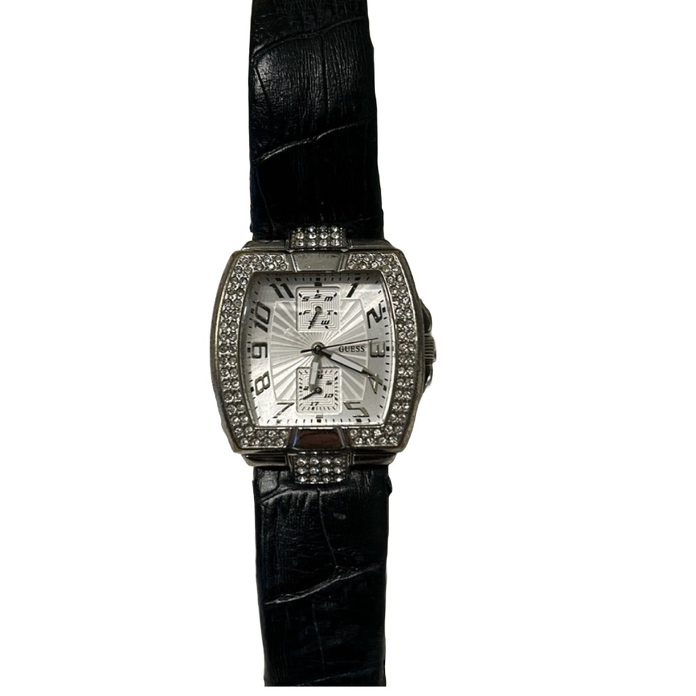 Guess ladies watch. Jewel details around face.